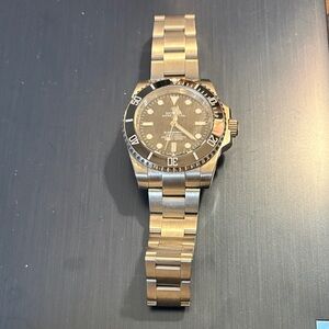 Silver and Black Submariner Watch